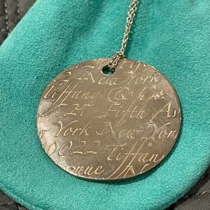 Tiffany & Co. Sterling silvery wavy notes Fifth Avenue disc necklace